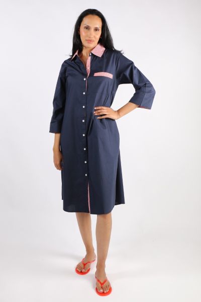 A classic shirt dress is hard to beat and this Harvey dress is one for the wardrobe staple. In a fun stripe color, it features a top to bottom button through closure with a collar and full cuffed sleeves with a black color under cuff. In a midi length, th