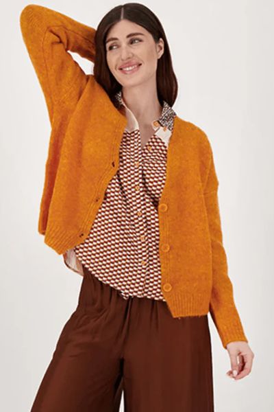 Layer up in style this season with this Irene Cardigan by Me369. In Solid color, it is a V neck knit long sleeve cardigan. Finished with Three button closure. This is a wardrobe essential that goes with everything.
