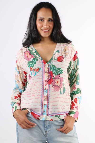 Accented with bold blooms in brilliant color, the Nisha Button Up Shirt is crafted from a sensuous silk blend. Featuring a V neckline and a dropped shoulder with roll tab sleeves, this elegant shirt is finished with a contrasting border for a unique look.