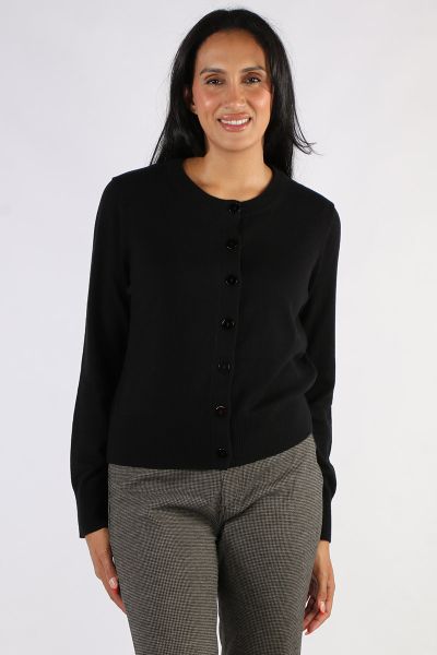 Layer up in style in this cardi by Jump. In a solid colour, this cardi has a round neck and full sleeves and is finished with ribbed cuffs and hem. Style it over dresses or easy separates. Style 58611004A.