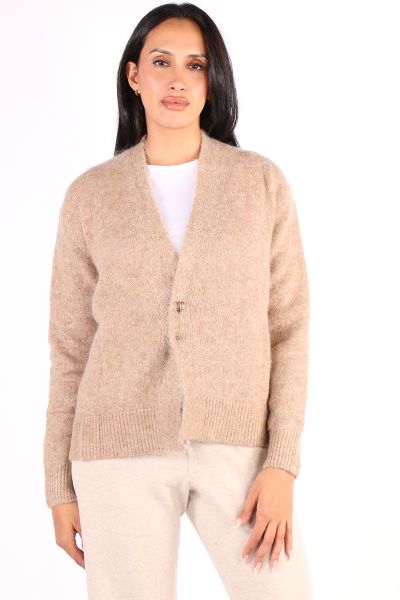 An easy and stylish way to elevate your look this season with this cardi by Jump. In a Super Kid Mohair Wool blend, the edge to edge cardi has full sleeves and a statement kilt pin front closure. Style this crop cardi over easy basics or dresses. Style 58