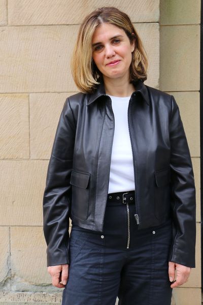 A clean cut leather jacket with a softly structured shape that feels polished without being overdone. The rich hazelnut tone adds warmth, while the minimal design keeps it timeless and easy to wear. Fitted through the shoulders with a relaxed finish throu