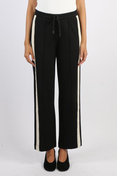 The Century Pant offers a relaxed wide leg fit with an elasticated waistband and drawcord for comfort. Featuring cream herringbone tape along the side seams and a pin tuck stitch down the centre leg, this versatile style blends ease with effortless sophis