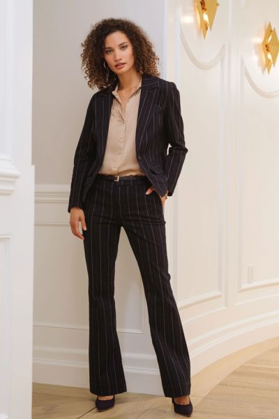 This indigo stripe denim jacket features a one button front to a lapel and collar, long sleeves with button details, front seam pockets with flaps and a pointed front hem. What a fun layering pieces! Style LM1A64SLS.