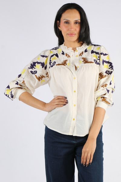 The Fenga Shirt blends crisp cotton with standout embroidery to deliver a fresh take on the classic white blouse. Crafted from 100% cotton, this lightweight button up features intricate multicolour embroidery across the yoke and sleeves, a softly gathered