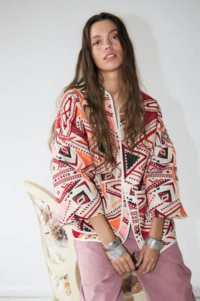 Playful and punchy, the Lulu Jacket is made for layering with personality. Crafted from a textured cotton blend in a bold geometric pattern, this open front jacket features a relaxed, boxy silhouette with wide sleeves and oversized front pockets. Finished