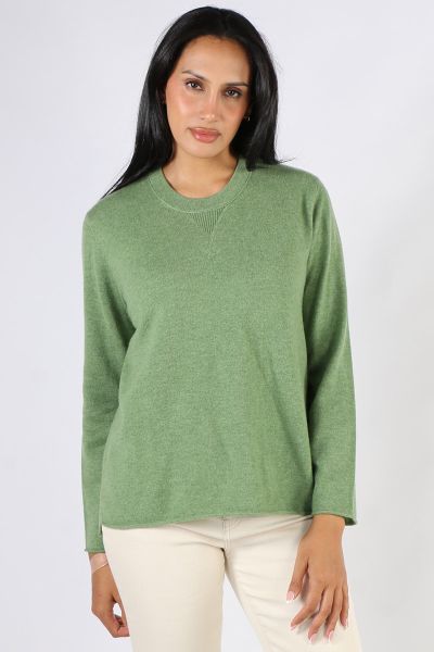 Soft and Cozy Juniper Jumper by Loobies story makes for a perfect staple. In a Cashmere blend, the easy cardi has a long sleeves, a high round neck and finished with side split hem for easy movement. Style with easy wide leg wool pants or skirts. Style LS