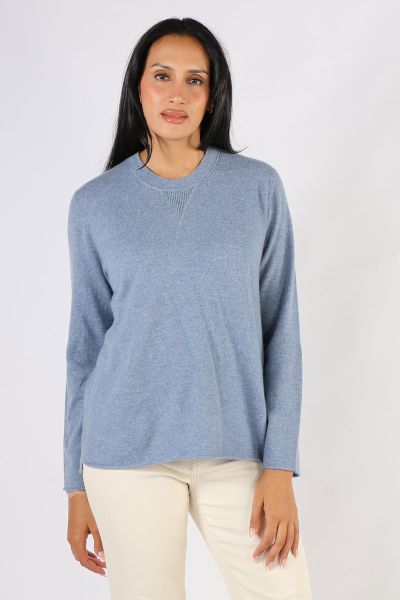 Soft and Cozy Juniper Jumper by Loobies story makes for a perfect staple. In a Cashmere blend, the easy cardi has a long sleeves, a high round neck and finished with side split hem for easy movement. Style with easy wide leg wool pants or skirts. Style LS