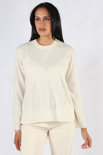 Soft and Cozy Juniper Jumper by Loobies story makes for a perfect staple. In a Cashmere blend, the easy cardi has a long sleeves, a high round neck and finished with side split hem for easy movement. Style with easy wide leg wool pants or skirts. Style LS
