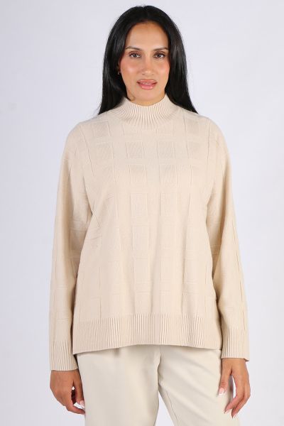 Go for a stylish and polished look in this Pippa Jumper by Loobies Story. In 100% Merino Wool, the basket weave jumper features a mock neck and full sleeves. Finished with ribbed hem and cuffs, style is with easy pants or denim. LSK2521.
