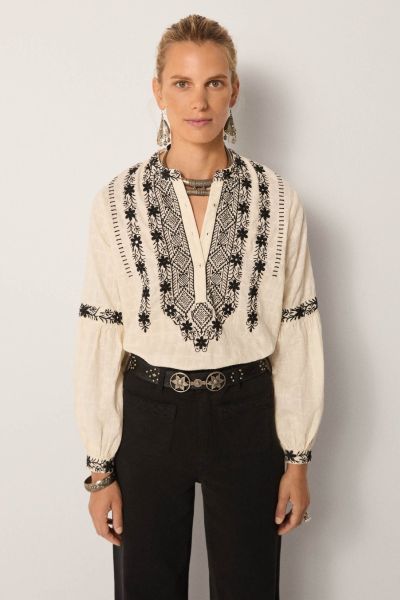 Strut your fashionable stuff everyday with Maison Hotel Bruna Orchid Shirt. The textured cotton shirt has a beautiful and stunning embroidered front along with long sleeves. Style this deluxe shirt with easy high waisted pants and assorted jewels with mes