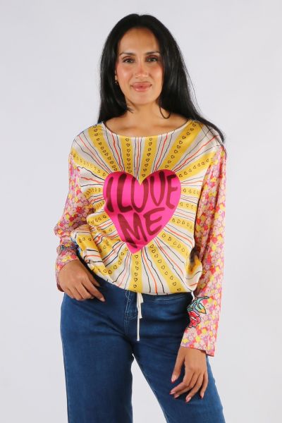 Round neck, pullover, long sleeve top in our Twisted Love print. Straight hemline with tie. Large red graphic heart on front which reads I LOVE ME . Dont you just love that Diagonal wide yellow stripes with little hearts radiate out from the center. Sleev