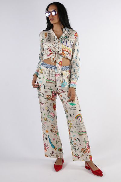 Viscose straight leg track pants with two side pockets and elastic waist. Print is Enlightenment featuring multi colred clouds, hearts snakes, hands and rainbows on a white background.Pair with our Billie Boyfriend shirt for a vivid, eye catching look.
