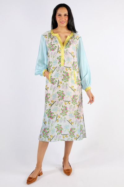 Midi length long sleeve placket dress in our Pura Vida pattern. Body of dress is floral, puffed sleeves are blue and placket and cuffs are yellow. Feminine, flattering and fun look.
