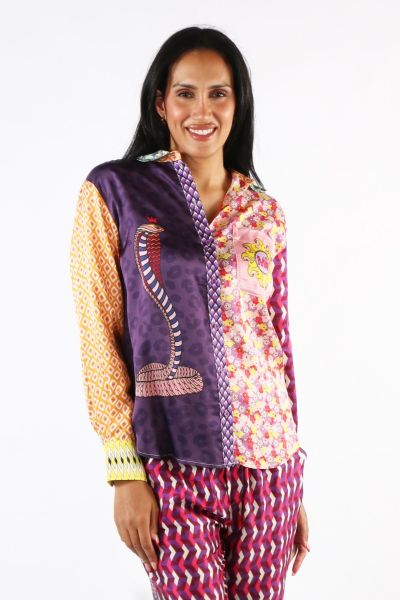 Long sleeve button down shirt with collar and cuffs in our Twisted Love print. Colors are mostly purples, yellow and oranges. Shirt is done in different geometric blocks. Large snake graphic on one side of front. The other side is done in flowers. The bac