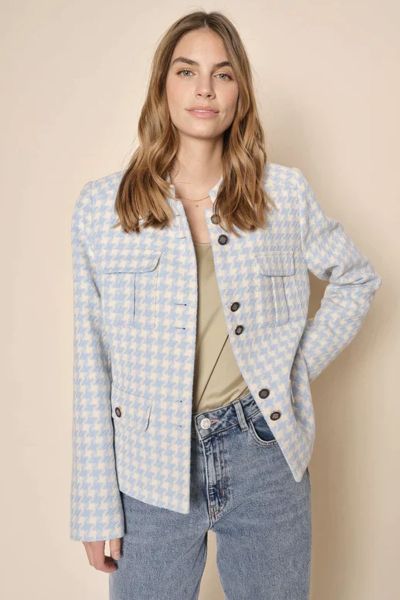 Channel your inner Jackie O this season with this houndstooth jacket by Mos Mosh. In an overall houndstooth pattern in tones of sky blue, the calming jacket has a front button closure and a mandarin collar, along with double safari front pockets and long 