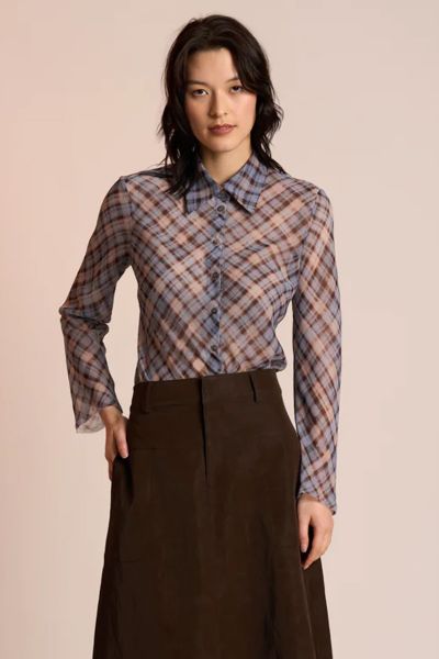 The Edgy Shirt by Neris is an elegant, elevated style crafted with a modern twist. Cut on the bias for a beautifully fluid drape, it features a classic collar and button up front. Raw edging at the hem and sleeves gives the shirt its signature attitude ba