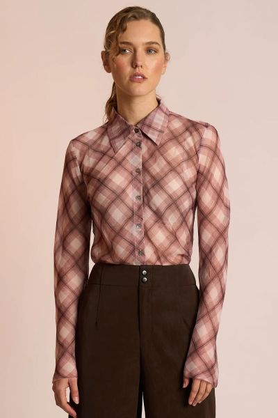 The Edgy Shirt by Neris is an elegant, elevated style crafted with a modern twist. Cut on the bias for a beautifully fluid drape, it features a classic collar and button up front. Raw edging at the hem and sleeves gives the shirt its signature attitude ba