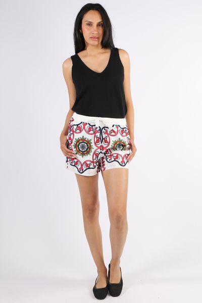 Elevate your summer wardrobe with these embroidered high waisted shorts crafted from lightweight, breathable cotton. Featuring a vibrant folk inspired pattern in red, green, navy, and black, the design offers a standout look with exceptional comfort. The 