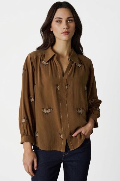 The Tapestry Shirt is a timeless blend of elegance and modern charm, featuring a delicate tonal cross stitched floral embroidery throughout the shirt. Thoughtful details like antique flower button at the neckline, contrast embroidery stitching down the ce