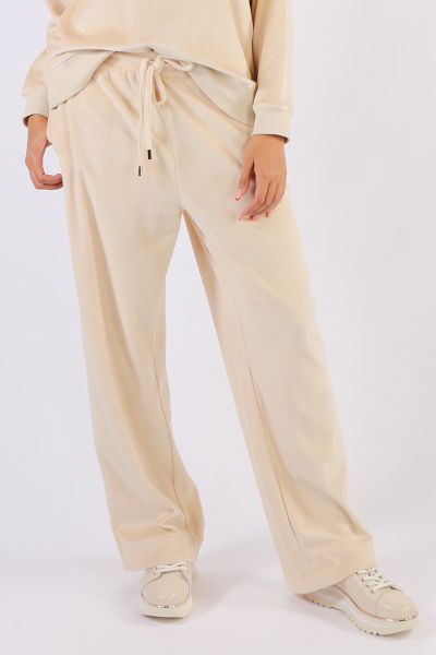 Where comfort meets luxury these velour cotton mid rise waisted pants are the ultimate smart casual leisure pants. Side seam pockets relaxed widish straight legs with adjustable drawstring waist. Team back with the matching zip jacket or simply with a tee