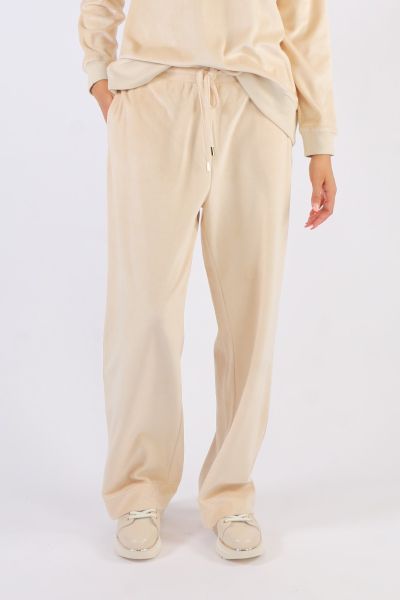 Where comfort meets luxury these velour cotton mid rise waisted pants are the ultimate smart casual leisure pants. Side seam pockets relaxed widish straight legs with adjustable drawstring waist. Team back with the matching zip jacket or simply with a tee