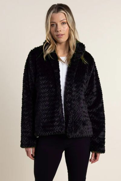 Introducing our Textured Fur Jacket, the ultimate blend of cozy comfort and luxurious style. Crafted with precision and care, its textured fur exterior exudes sophistication while keeping you warm throughout the season.With its chic design and plush feel,