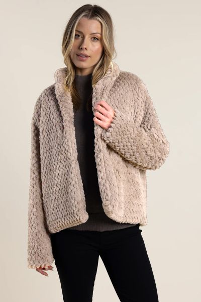Introducing our Textured Fur Jacket, the ultimate blend of cozy comfort and luxurious style. Crafted with precision and care, its textured fur exterior exudes sophistication while keeping you warm throughout the season.With its chic design and plush feel,