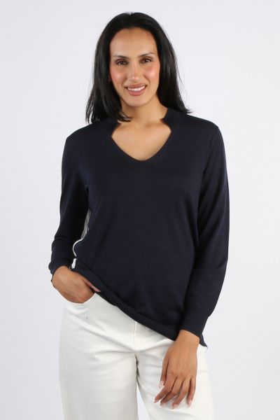 The Manhattan Sweater features a relaxed fit, a rib Mandarin collar, and contrast trim on the center back and sides. The full length sleeves are finished with a deep rib, while the ribbed hemline falls below the hip for a stylish look. 9692USF.
