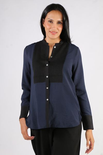 Designed with versatility in mind, this shirt effortlessly transitions from desk to dinner. Crafted from a subtle and lightweight fabric with colour contrast, it stands out with pintuck detailing at the front chest, adding an elegant touch. The timeless h