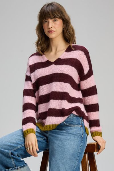 This striped knit jumper brings a playful yet refined touch to everyday dressing. Featuring bold horizontal stripes in soft pink and rich burgundy, its finished with subtle contrast trims at the cuffs and hem for an added pop of colour. Zp8140.