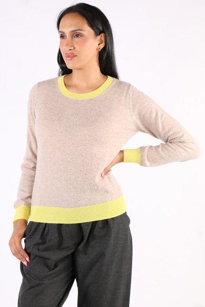 A bit of a retro vibe this season by Aldo Martins is a go to for the season. The cashmere jumper has round neck and long sleeves and is finished with contrasting trims at neckline, hem and cuffs. Style it with wide leg jeans and boots.
