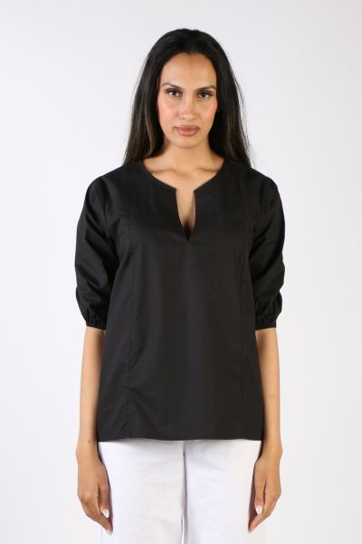 Go for easy vibes this season in this Elka top by Bagruu. In a round split neck and a panelled design, the top has peasant sleeves and can be styled with easy pants for a perfect day to night look. 