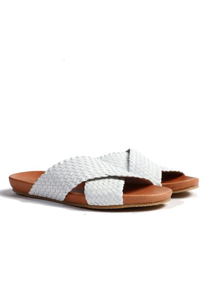 Slides by DP are a statement style made with an incredible woven textured leather. Crafted with a rounded mouled footbed and a minimal heel, this flat will match any outfit in your wardrobe. It will be staple for summertime. Style 54609NEXS2.