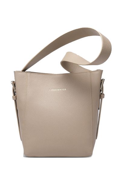 The Louenhide Farrell Shoulder Bag is a modern take on a classic bucket bag silhouette designed to elevate your style and keep your essentials organised. Featuring a textured vegan leather exterior this bag boasts a sleek and sophisticated design that eff