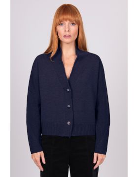 A Boxy fit relaxed cardigan with ribbed shawl collar and detailed, cable panel feature. Dropped shoulders for an easy to wear, relaxed look. High hip length. The collar can be worn high or folded for a roll collar effect. Horn-look buttons for a stylish f