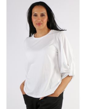 An easy white top is a summer staple and this one fits the bill perfectly. In a round neck and 3/4 sleeves, the the statement gathered sleeve design gives it a little something extra. Style it with easy pants or skirts. 5850.
