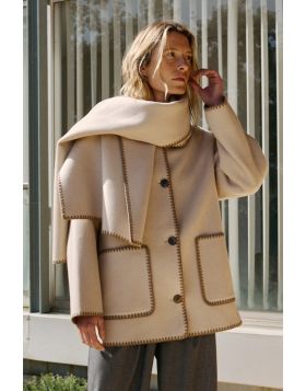 If you like small details, this wool coat with an added scarf is made for you. All the finishes on this garment are hand embroidered, and its regular fit looks great. BY606.
