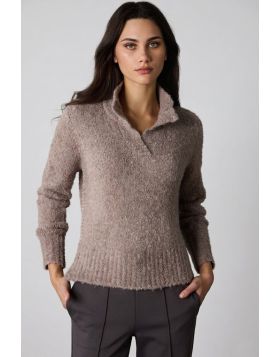 The Cellar Sweater, crafted from a soft wool alpaca blend, delivers ultimate coziness. Featuring a classic placket neckline and contrast fishbone embroidery along the side seams, this timeless piece combines warmth with subtle detailing for an effortless 