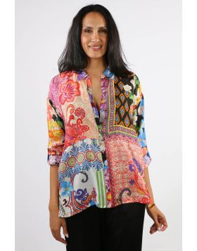 Beautifully crafted from luxurious 100% silk, the Magnolia Mae Audrey Shirt is embellished with a patchwork of vibrant color and patterns. Designed with a classic collared button front and drop shoulder long sleeves, this bold blouse is finished with side