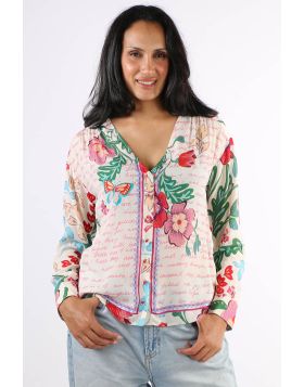 Accented with bold blooms in brilliant color, the Nisha Button Up Shirt is crafted from a sensuous silk blend. Featuring a V neckline and a dropped shoulder with roll tab sleeves, this elegant shirt is finished with a contrasting border for a unique look.