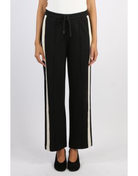The Century Pant offers a relaxed wide leg fit with an elasticated waistband and drawcord for comfort. Featuring cream herringbone tape along the side seams and a pin tuck stitch down the centre leg, this versatile style blends ease with effortless sophis