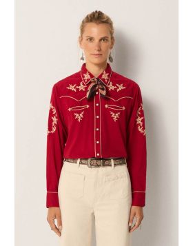 Turn heads for all the right reasons this season in this Western inspired shirt by Maison Hotel. In cotton, the shirt has embroidered motifs, along with button up front, long sleeves and easy and luxe vibes. Cut from cotton and inspired by Western classic