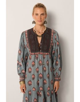 A dress that is bound to get you compliments, this Allegra dress does just that. The dress in a rich hand block printed textile in water lillies motifs all over, has a contrast panel, full sleeves with gathered details and the maxi length that sashays wit