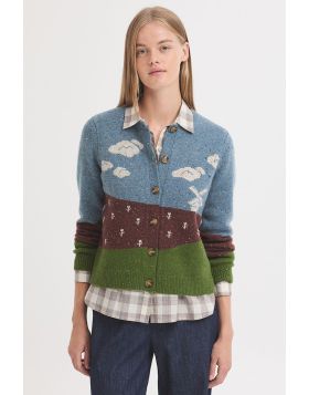 Inspired by the peaceful charm of the Dutch countryside, this cozy knit sweater captures a scenic landscape of Holland complete with rolling green fields, soft blue skies, and a classic windmill standing quietly in the distance. Rendered in shades of gree