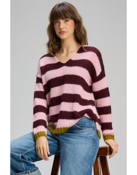 This striped knit jumper brings a playful yet refined touch to everyday dressing. Featuring bold horizontal stripes in soft pink and rich burgundy, its finished with subtle contrast trims at the cuffs and hem for an added pop of colour. Zp8140.