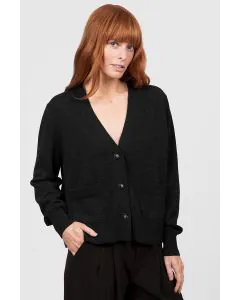 Elevate your layering wardrobe with the V Neck Relaxed Cropped Cardigan, a chic fusion of modern simplicity and cozy comfort. Crafted to be effortlessly versatile, this cardigan features a flattering cropped length and relaxed fit that pairs seamlessly wi