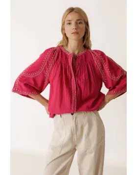 Effortless boho chic meets everyday comfort. Crafted from lightweight, breathable cotton, this shirt features beautiful contrasting ethnic embroidery that adds a touch of artisan charm to your wardrobe. Romantic bell sleeves, delicate shoulder pleats, and