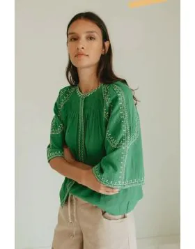 Effortless boho chic meets everyday comfort. Crafted from lightweight, breathable cotton, this shirt features beautiful contrasting ethnic embroidery that adds a touch of artisan charm to your wardrobe. Romantic bell sleeves, delicate shoulder pleats, and