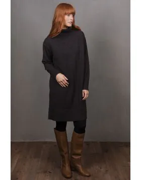 The Sweater Dress a quintessential piece of cozy sophistication designed to elevate your seasonal wardrobe. This elegantly simple dress combines structure with softness, offering a flattering silhouette that drapes effortlessly from shoulder to hem. Ideal